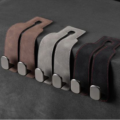 HangEase Organizer z Inicala.pl – zestaw luksusowych, podwójnych wieszaków w kolorze brązowym, szarym i czarnym z czerwonym przeszyciem, ułożonych obok siebie