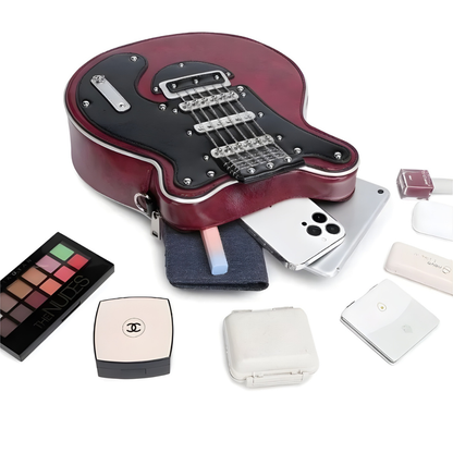 Torebka Guitarista™ z Inicala.nl w kształcie gitary – bordowy model z czarnym frontem, pokazujący pojemność i akcesoria, które mieszczą się w środku